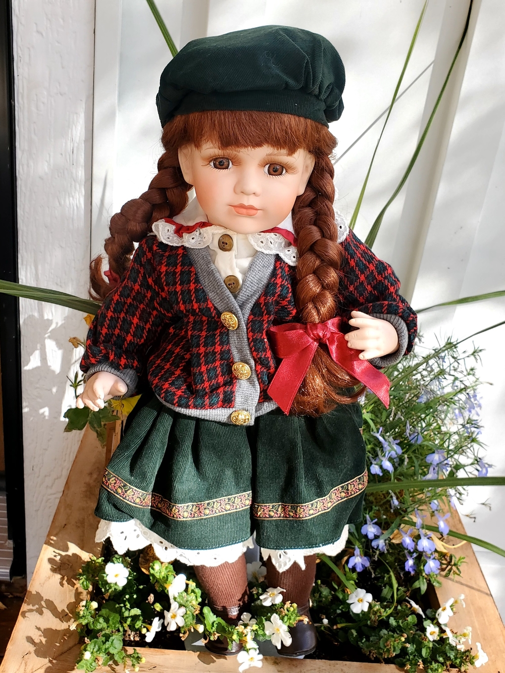 Classic Porcelain Girl Doll in Green Outfit with Red Plaid Jacket